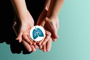 Adult and child hands holding lung, world tuberculosis day, world no tobacco day, lung cancer, coronavirus covid-19, Pulmonary hypertension, Pneumonia, copd, eco air pollution,organ donation concept photo