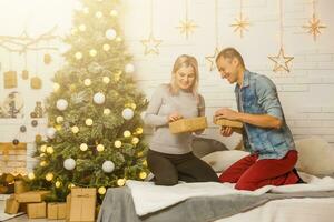 Christmas couple with present photo