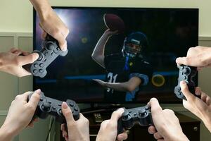 hands with joystick play football photo