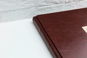 Brown leather photo album cover background. Keeping memories alive throughout the years concept