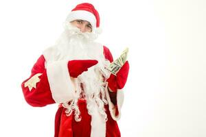 Santa Claus holding money. Isolated. photo