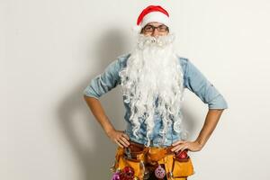 Santa Claus. Young Happy Emotional Santa Man Winner Gesture. Christmas sack bag, Presents Having Fun. New Year. Stylish Colorful New Year Holiday photo