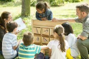 School children learning about bird species photo