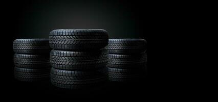 four black tires isolated on white background photo