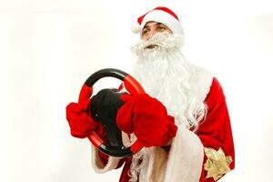 Santa Claus with a wheel on a white background photo