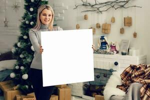Beautiful blonde girl artist posing near the white empty canvas - beauty photo for clipping path advertisement models.