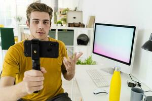Fitness trainer talking on live streaming while sitting at home photo