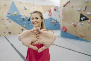 Portrait of a confident woman in climbing gym photo