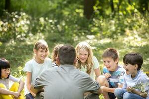 School children learning to to distinguish different plants photo