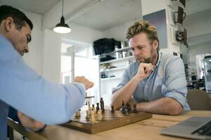 Two men playing chess photo