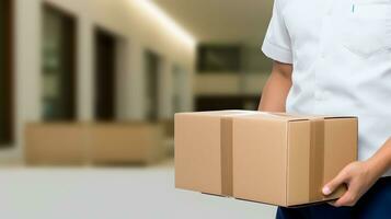 Delivery man holding parcel box photo
