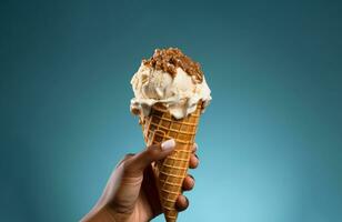 Hand holding vanilla ice cream cone on blue background AI Generative photo