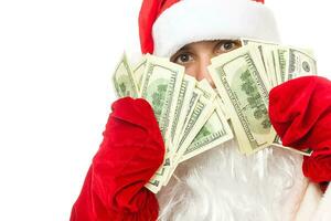 Close-up of Santa, hands with dollar banknotes photo