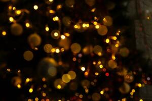 blur light celebration on christmas tree with white wall background photo