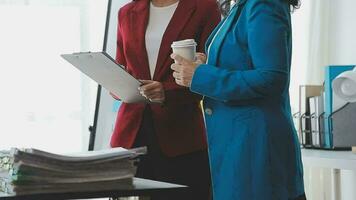 Team of business people working together in the meeting room office, teamwork background charts and graphs banner, double exposure successful teamwork,business planning concept. video