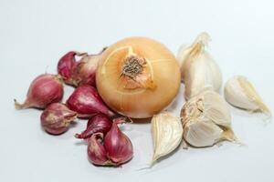 Whole onion bulb on white background. Onion set. photo