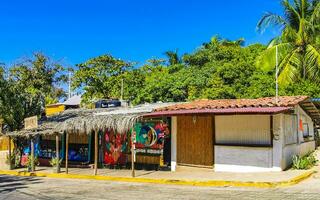 Puerto Escondido Oaxaca Mexico 2023 Typical beautiful colorful tourist street sidewalk city Puerto Escondido Mexico. photo