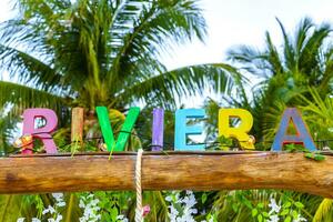 Playa del Carmen Quintana Roo Mexico 2023 Colorful Riviera Maya swing lettering sign symbol on beach Mexico. photo