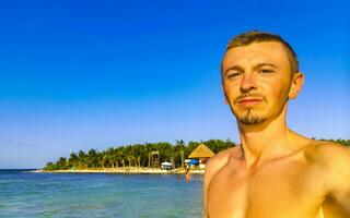 Male tourist Travelling man taking selfie Playa del Carmen Mexico. photo