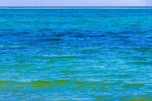 Waves at tropical beach caribbean sea clear turquoise water Mexico. photo