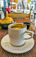 Cup of americano black coffee in restaurant cafe in Mexico. photo