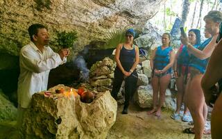 Playa del Carmen Quintana Roo Mexico 2023 Mayan shaman makes purification ceremony in cenote in Tulum Mexico. photo