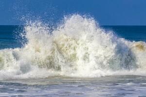 Extremely huge big surfer waves at beach Puerto Escondido Mexico. photo