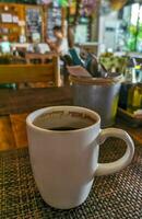 Cup of americano black coffee in restaurant cafe in Mexico. photo