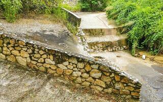 Open sewerage system in the tropical jungle mountains Mexico. photo