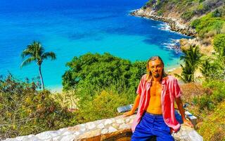 Selfie rocks cliffs view waves Carrizalillo beach Puerto Escondido Mexico. photo