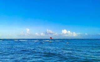 Red flag swimming prohibited high waves Playa del Carmen Mexico. photo