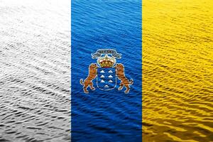 Flag and coat of arms of Canary Islands on a textured background. Concept collage. photo