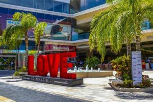 Playa del Carmen Quintana Roo Mexico 2023 Red love lettering sign symbol in Playa del Carmen Mexico. photo