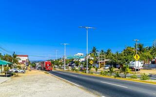 Puerto Escondido Oaxaca Mexico 2023 Typical beautiful colorful tourist street sidewalk city Puerto Escondido Mexico. photo