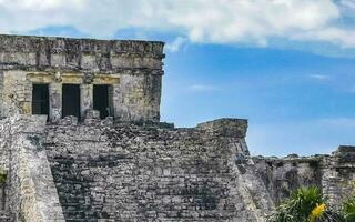 Ancient Tulum ruins Mayan site temple pyramids artifacts landscape Mexico. photo