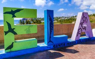 Puerto Escondido Oaxaca Mexico 2023 Colorful Zicatela Puerto Escondido lettering sign symbol on beach Mexico. photo