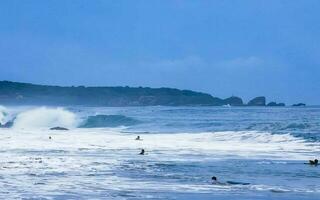 Puerto Escondido Oaxaco Mexico 2022 Surfer surfing on surfboard on high waves in Puerto Escondido Mexico. photo