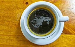 Cup of americano black coffee in restaurant cafe in Mexico. photo