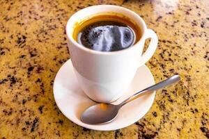 Cup of americano black coffee in restaurant Costa Rica. photo