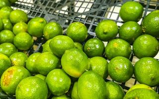 Juicy green lime lemon citrus fruit fruits supermarket Mexico. photo