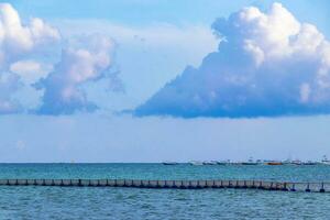 Blue water waves ocean with buoy buoys ropes nets Mexico. photo