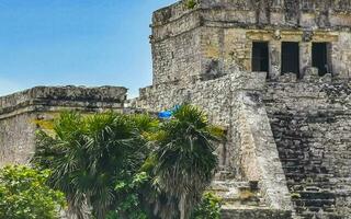 Ancient Tulum ruins Mayan site temple pyramids artifacts landscape Mexico. photo