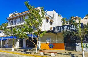 Puerto Escondido Oaxaca Mexico 2023 Typical beautiful colorful tourist street sidewalk city Puerto Escondido Mexico. photo