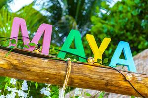 Playa del Carmen Quintana Roo Mexico 2023 Colorful Riviera Maya swing lettering sign symbol on beach Mexico. photo