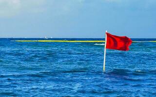 Red flag swimming prohibited high waves Playa del Carmen Mexico. photo