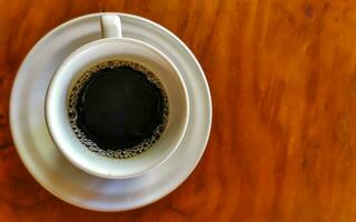 Cup of americano black coffee in restaurant Mexico. photo