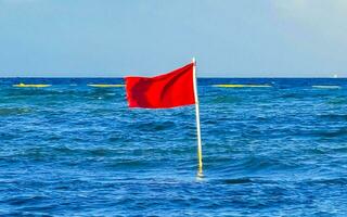 Red flag swimming prohibited high waves Playa del Carmen Mexico. photo