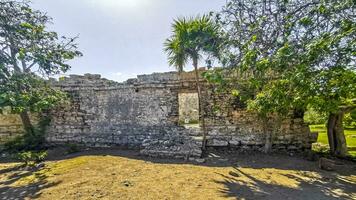 Ancient Tulum ruins Mayan site temple pyramids artifacts landscape Mexico. photo