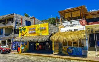 Puerto Escondido Oaxaca Mexico 2023 Typical beautiful colorful tourist street sidewalk city Puerto Escondido Mexico. photo