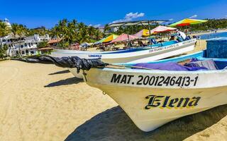 Puerto Escondido Oaxaca Mexico 2023 Fishing boats at the harbor beach in Puerto Escondido Mexico. photo